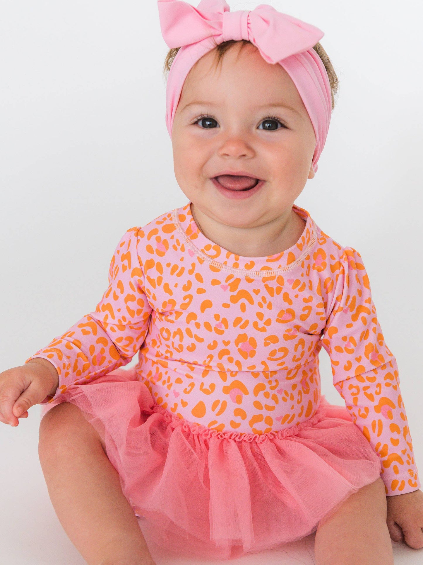 RuffleButts + RuggedButts - Baby Girls Pink Leopard Tulle Skirted One Piece Rash Guard Swimsuit