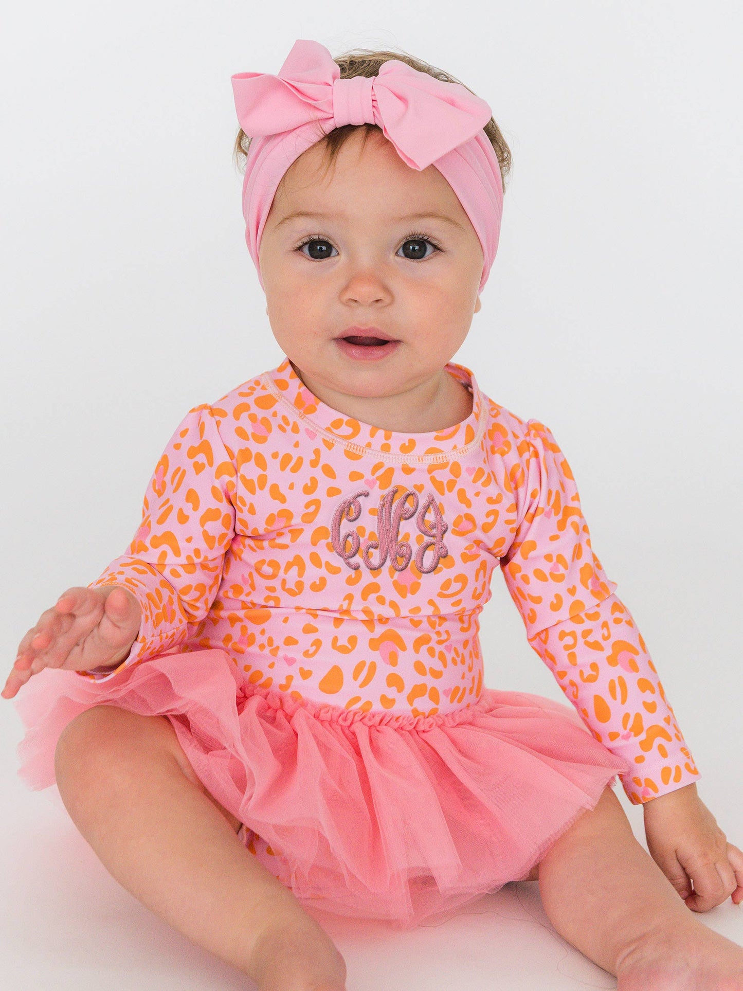 RuffleButts + RuggedButts - Baby Girls Pink Leopard Tulle Skirted One Piece Rash Guard Swimsuit